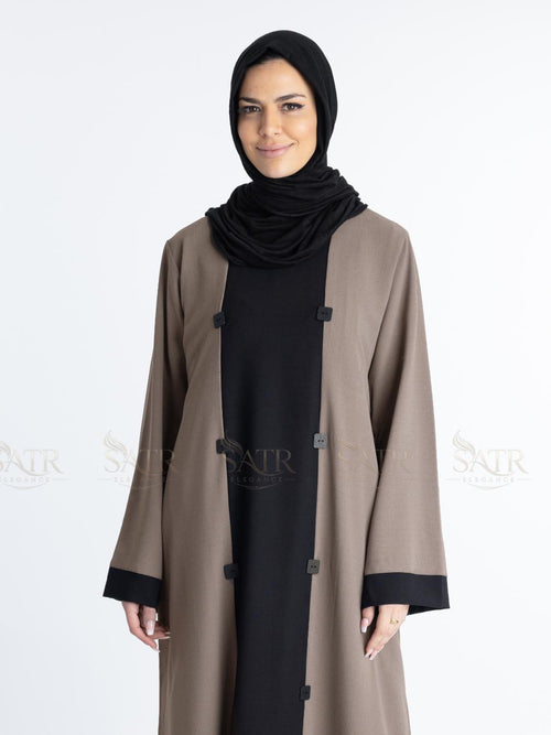 Women with dual tone Abaya black in middle and brown on both sides with white background. Clean and elegant look for casual occasions.