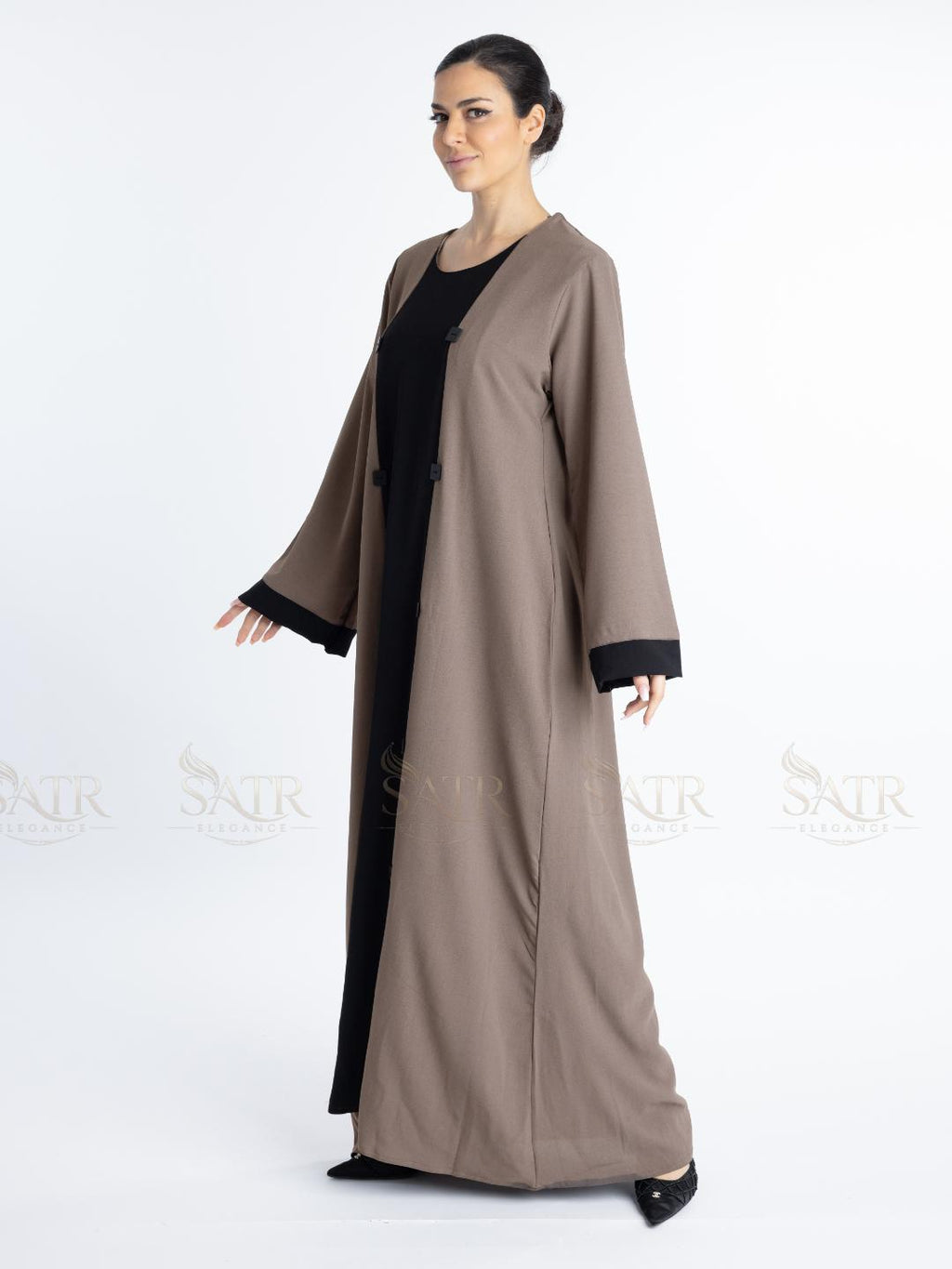 Women with dual tone Abaya black in middle and brown on both sides with white background. Clean and elegant look for casual occasions.