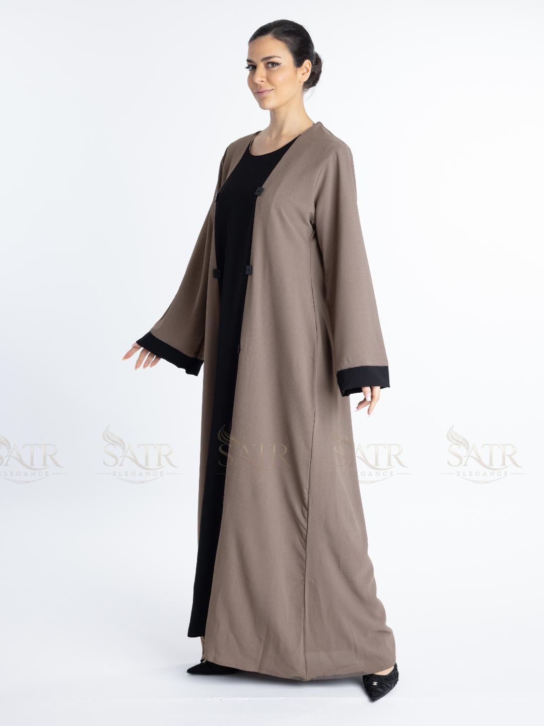 Women with dual tone Abaya black in middle and brown on both sides with white background. Clean and elegant look for casual occasions.