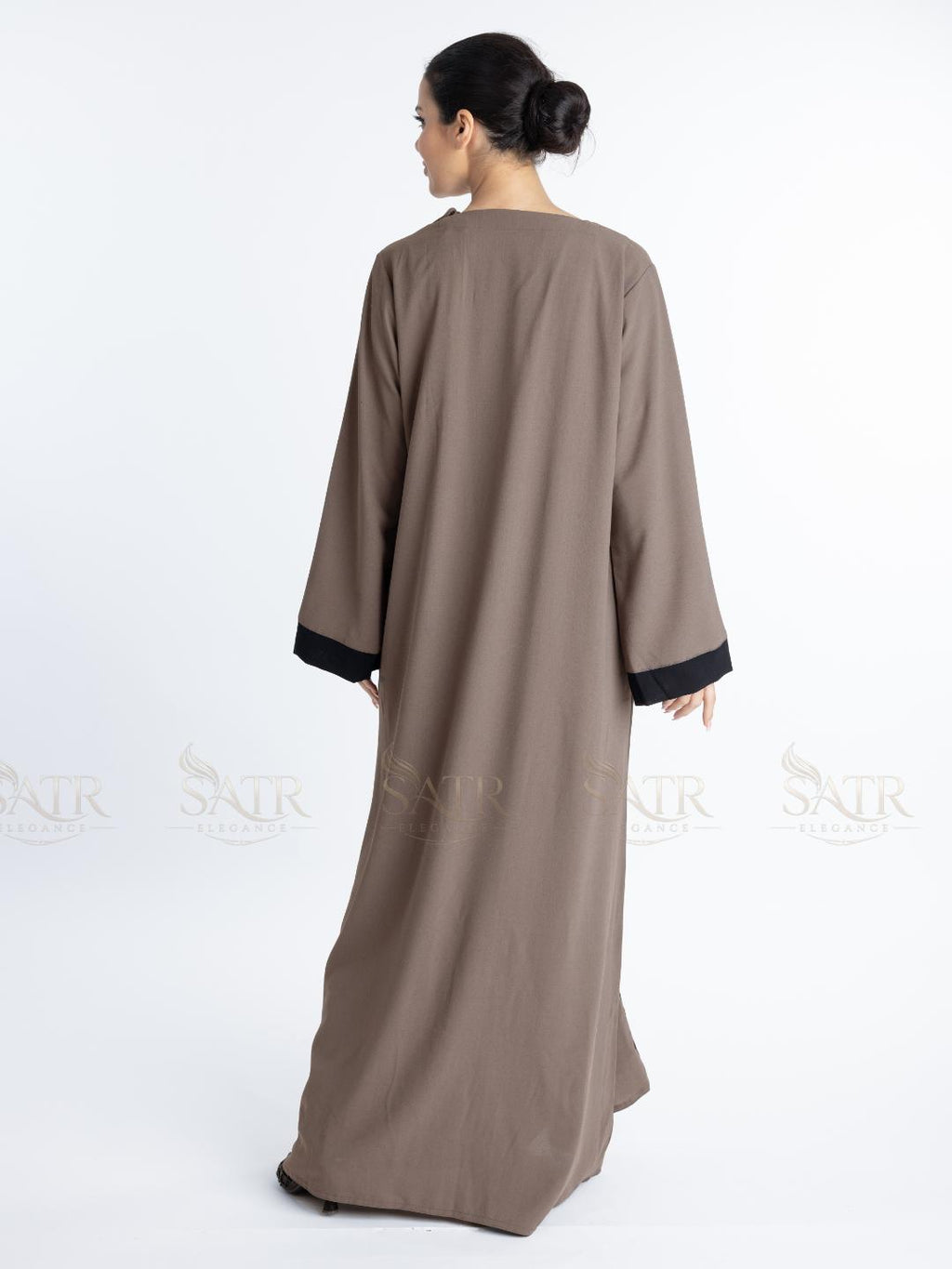 Women with dual tone Abaya black in middle and brown on both sides with white background. Clean and elegant look for casual occasions.