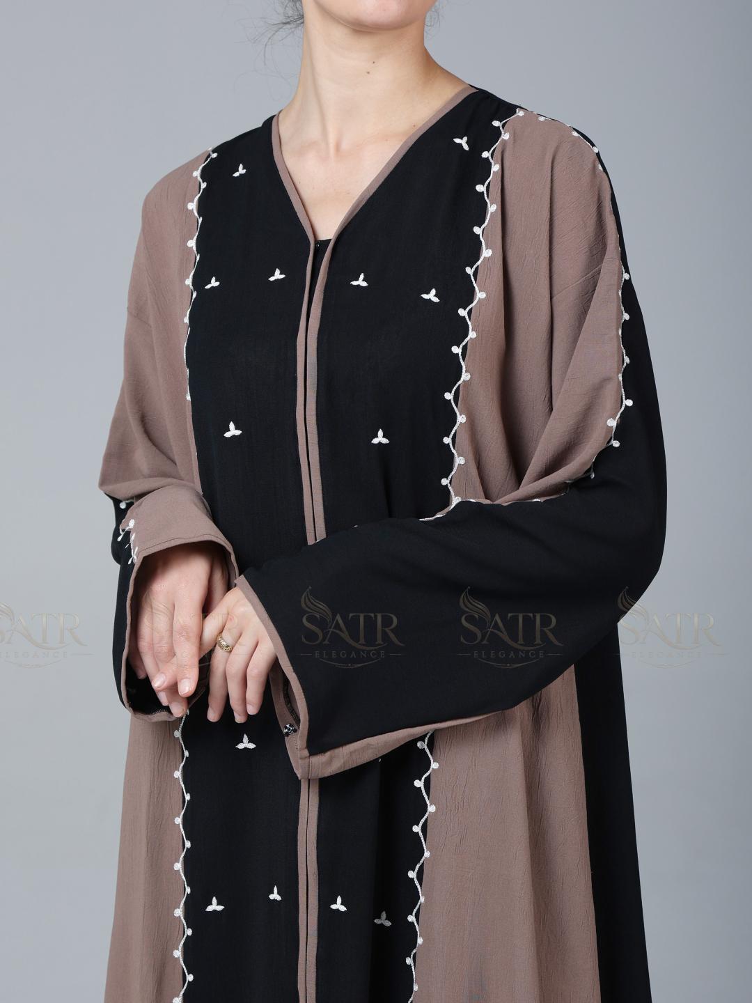 Black and brown traditional outfit with 'SATR' branding on a gray background